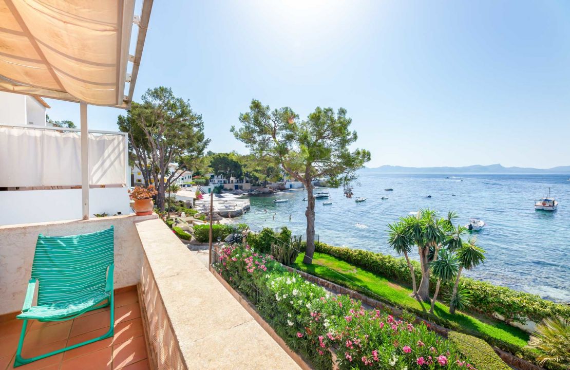 Second line Mediterranean beach house in Alcudia, Alcanada with stunning sea views and rental license