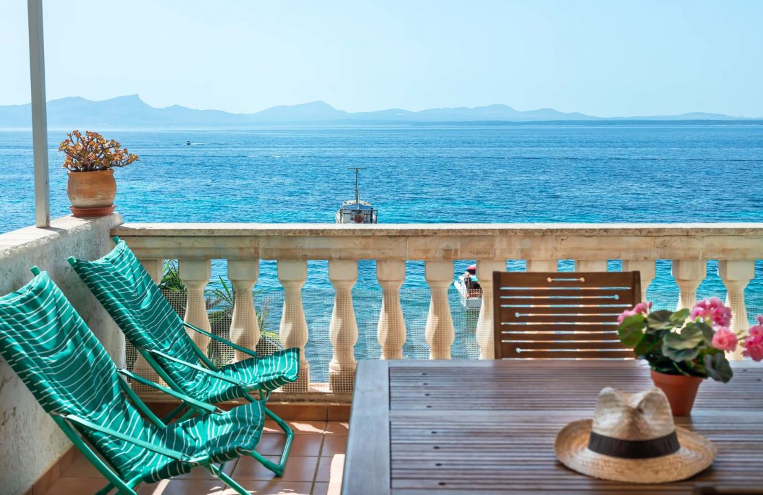 Second line Mediterranean beach house in Alcudia, Alcanada with stunning sea views and rental license