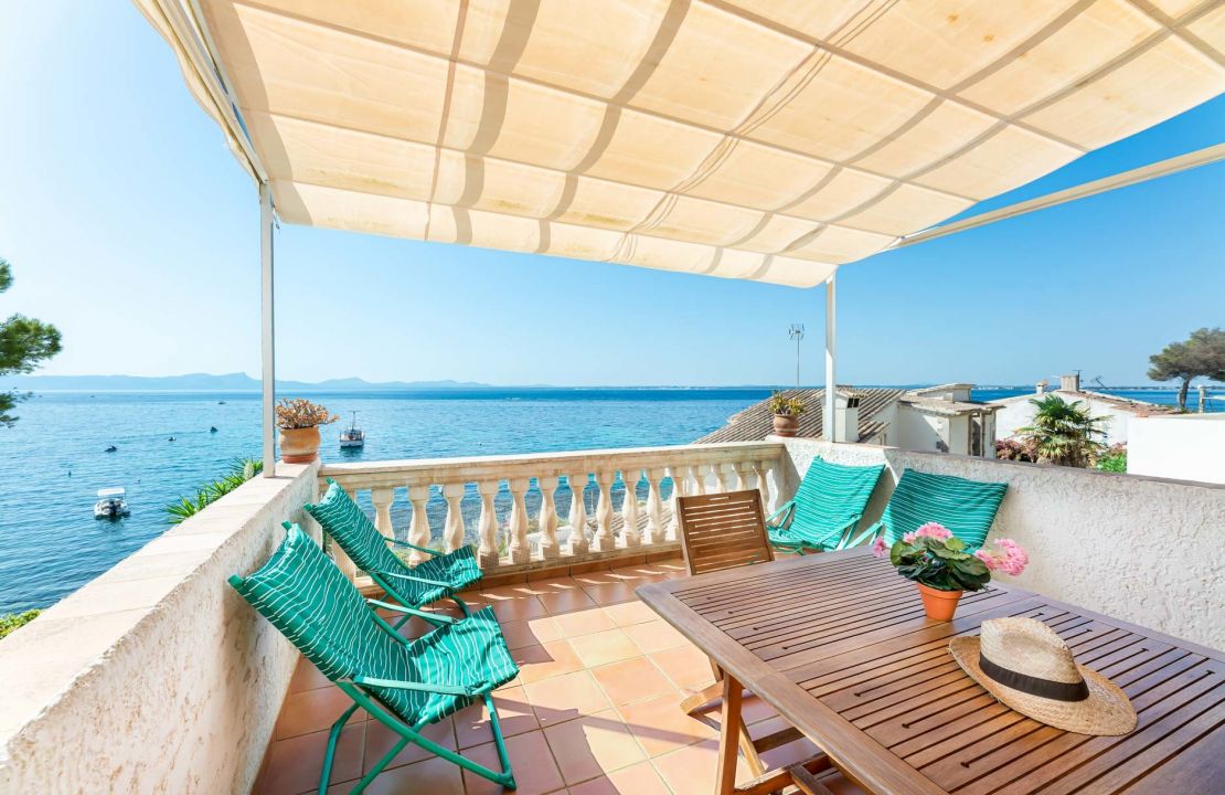 Second line Mediterranean beach house in Alcudia, Alcanada with stunning sea views and rental license