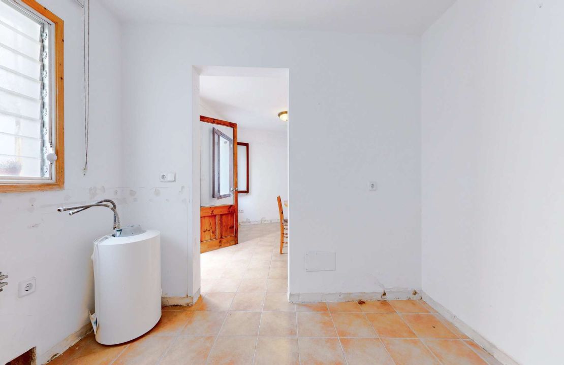 Townhouse in Pollenca Mallorca with large patio and renovation project