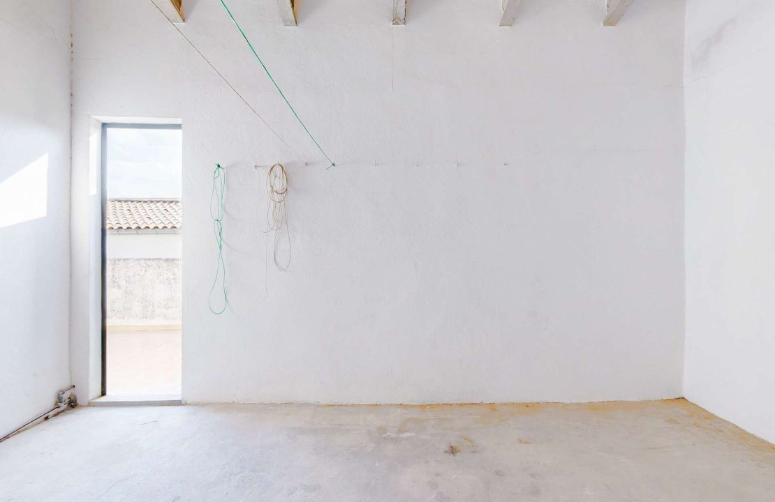 Townhouse in Pollenca Mallorca with large patio and renovation project