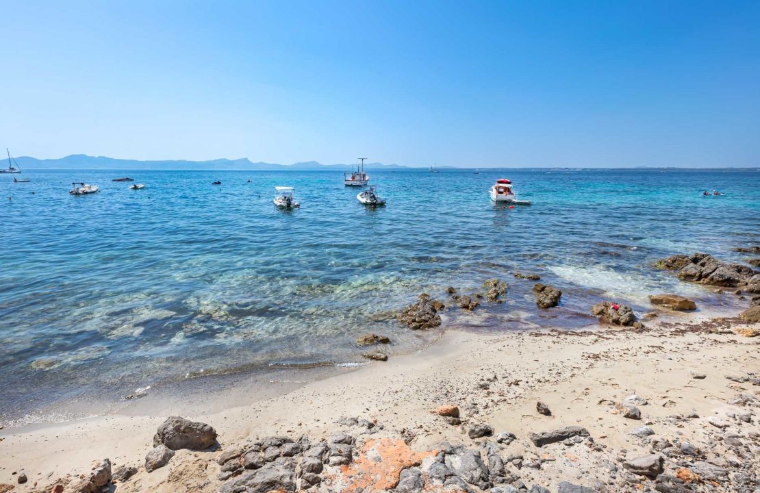 Second line Mediterranean beach house in Alcudia, Alcanada with stunning sea views and rental license