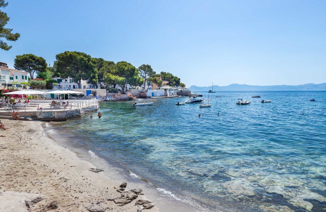 Second line Mediterranean beach house in Alcudia, Alcanada with stunning sea views and rental license