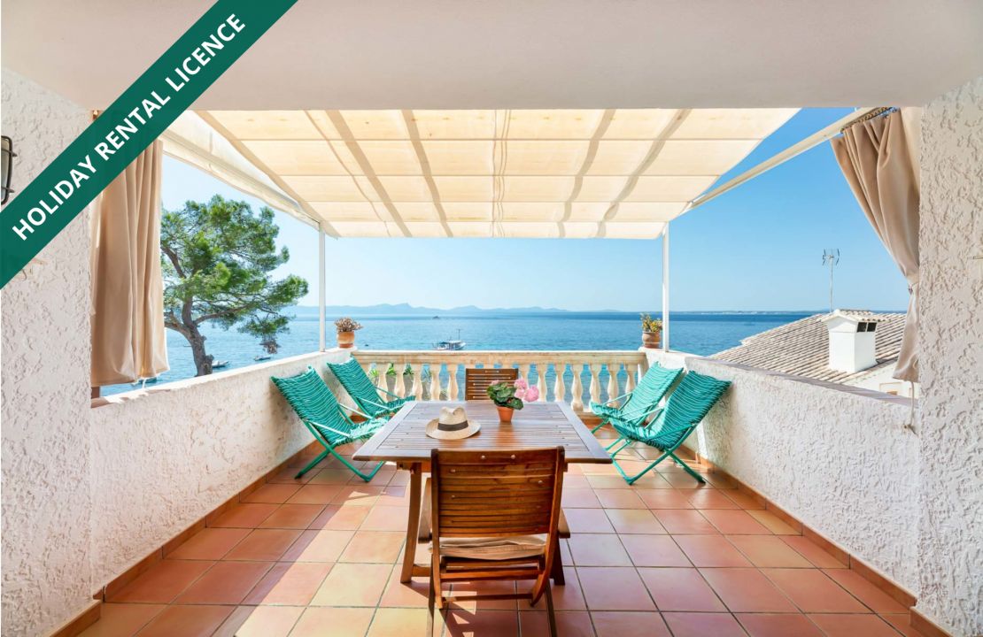 Second line Mediterranean beach house in Alcudia, Alcanada with stunning sea views and rental license