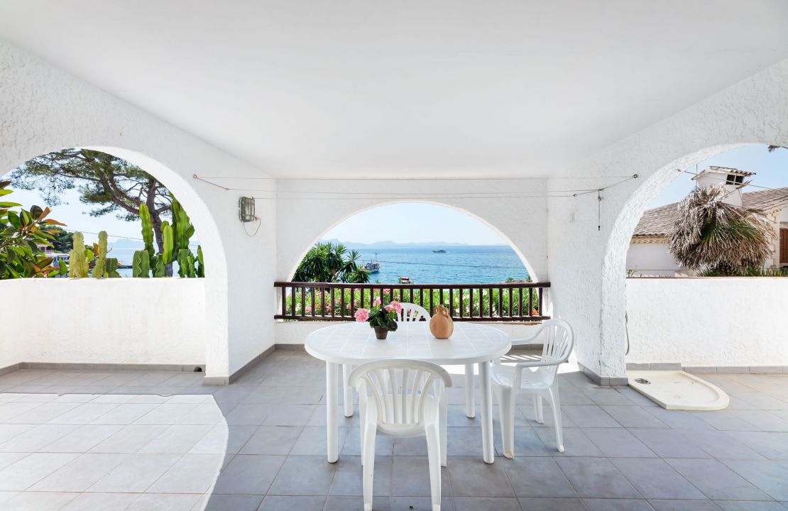 Second line Mediterranean beach house in Alcudia, Alcanada with stunning sea views and rental license