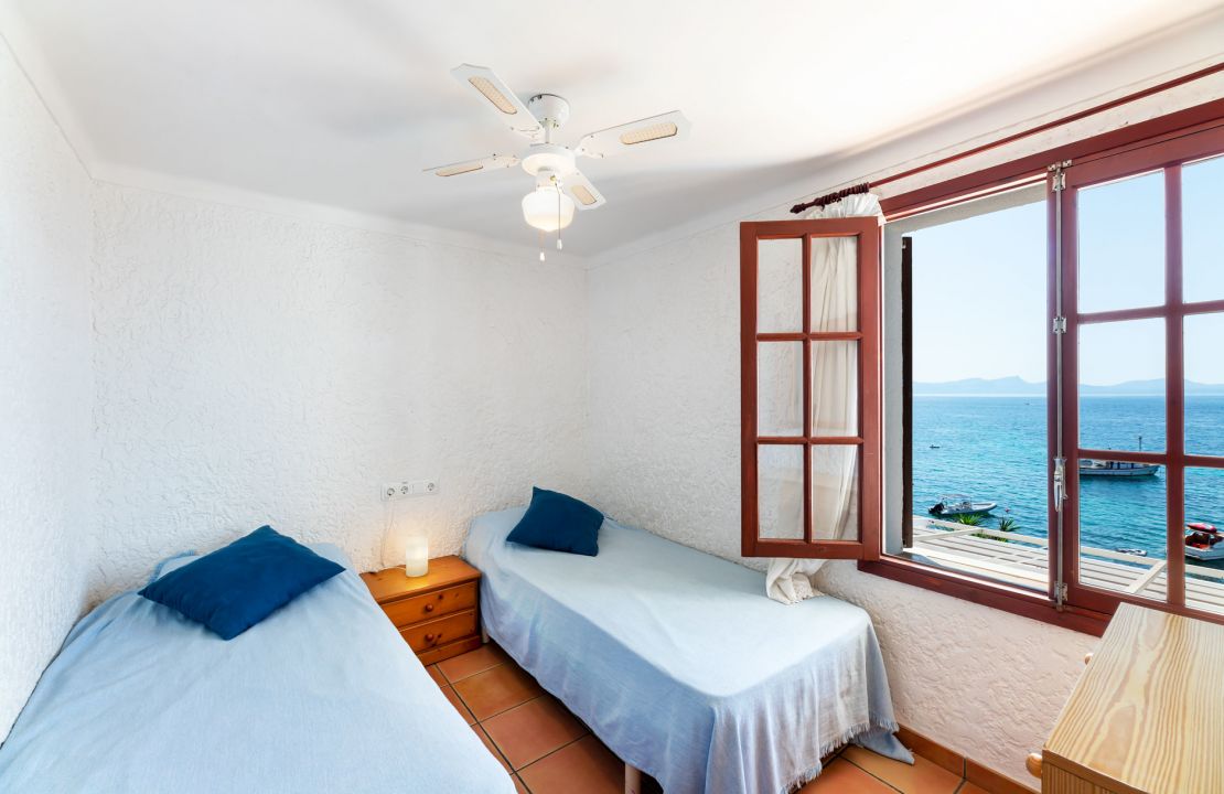 Second line Mediterranean beach house in Alcudia, Alcanada with stunning sea views and rental license