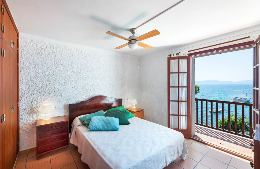 Second line Mediterranean beach house in Alcudia, Alcanada with stunning sea views and rental license