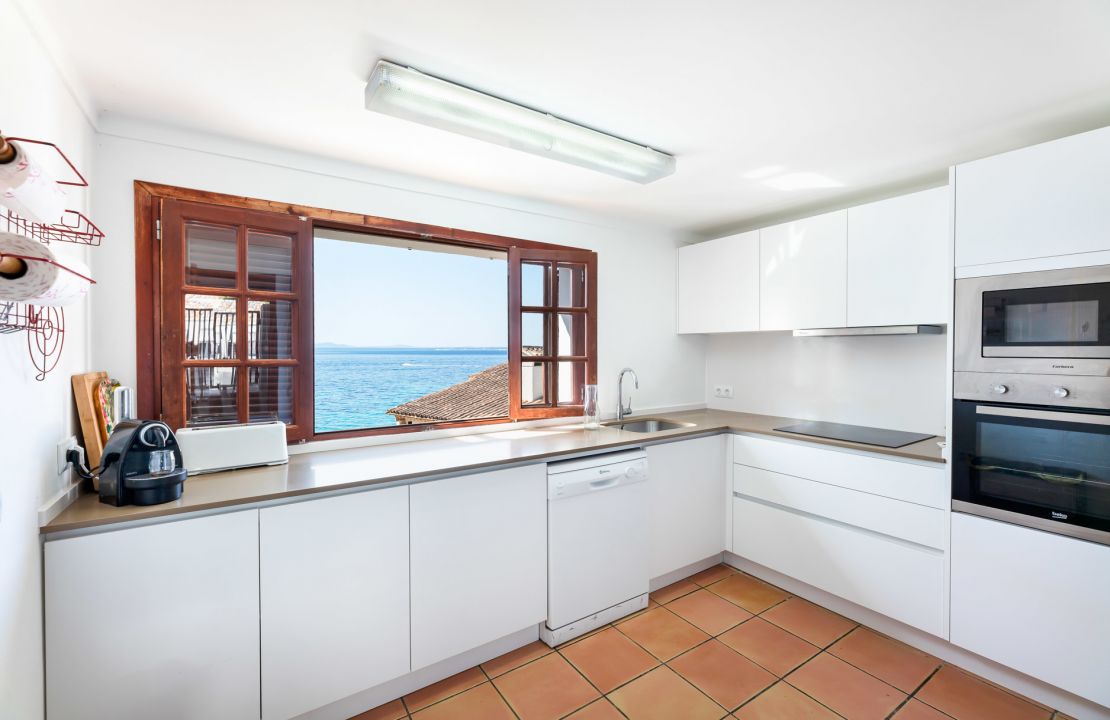 Second line Mediterranean beach house in Alcudia, Alcanada with stunning sea views and rental license