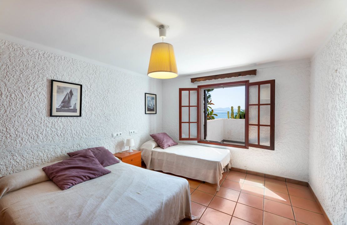 Second line Mediterranean beach house in Alcudia, Alcanada with stunning sea views and rental license