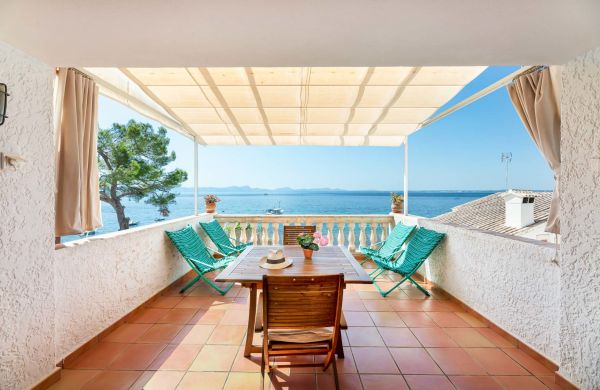 Second line Mediterranean beach house in Alcudia, Alcanada with stunning sea views and rental license
